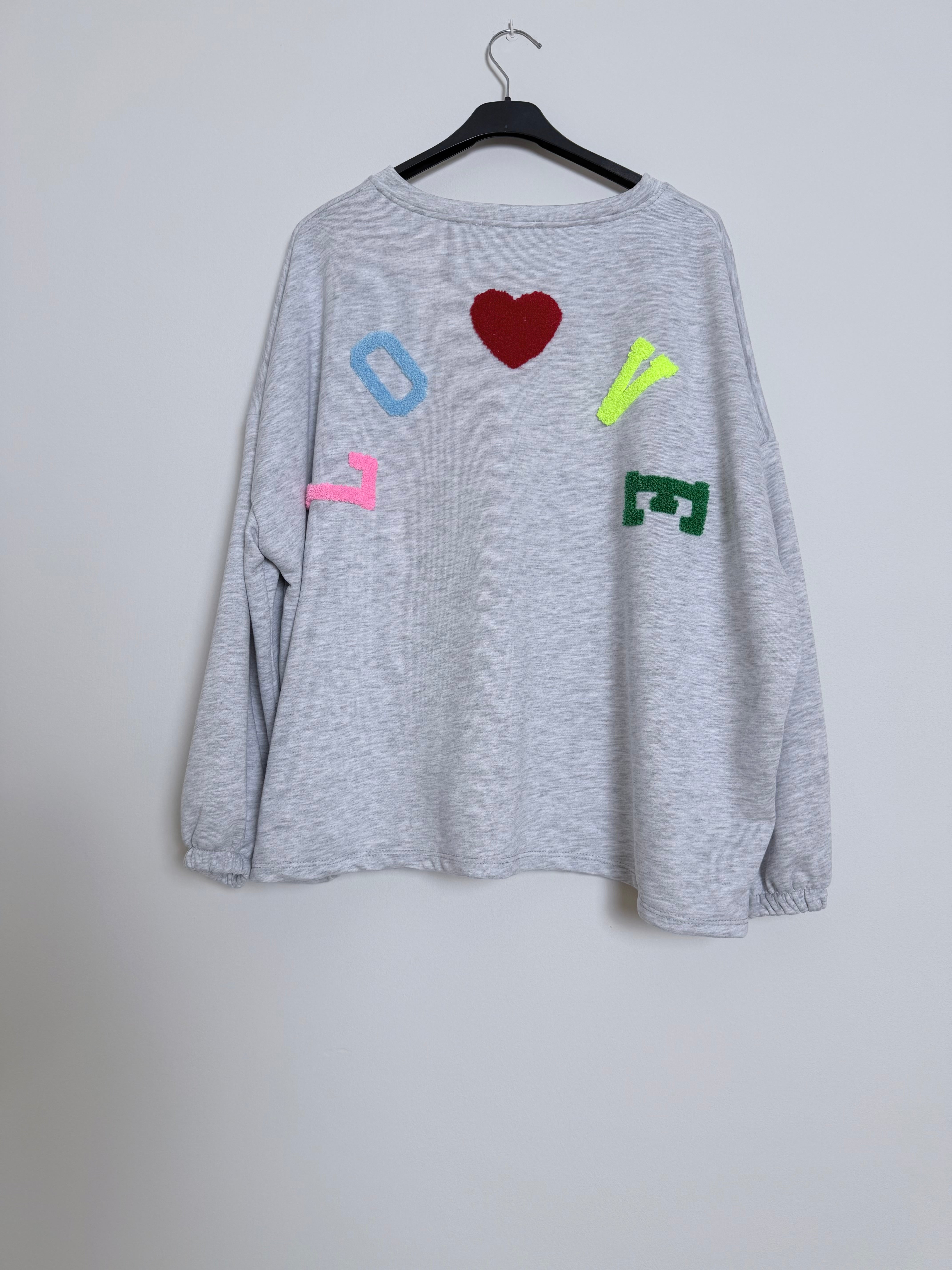 Felpa Love grigia scritta multicolor